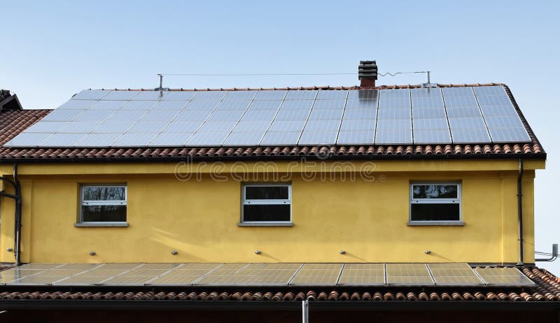 Solar Panels for renewable electrical energy production on the roofs royalty free stock photos