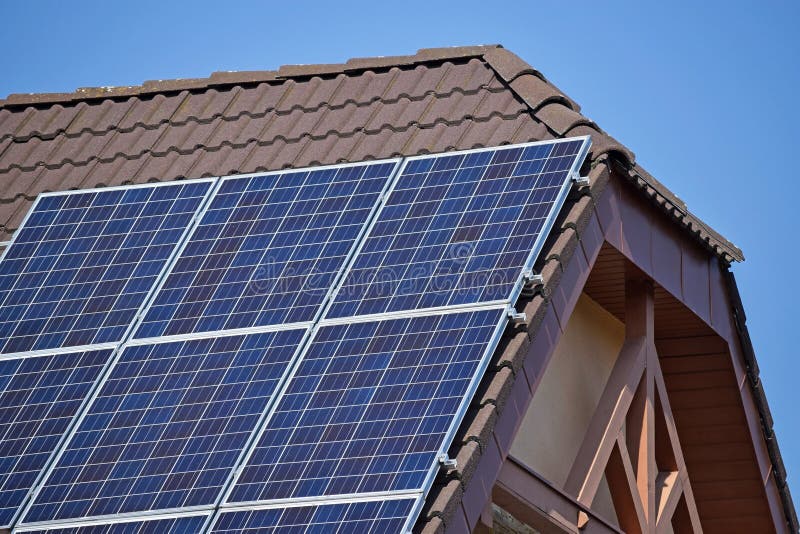 Solar panels on the roof of a house stock photos