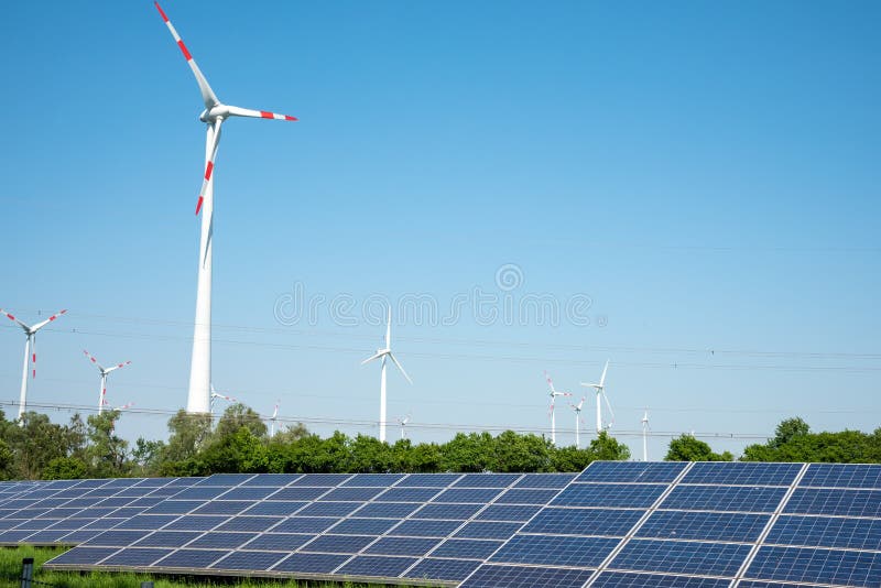 Solar panels, wind power plants and overhead lines royalty free stock photos