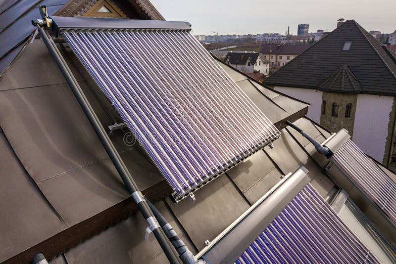 Solar water heating system on house roof. Hot water boiler, alternative ecological sun energy generator. Modern technology concept royalty free stock images Solar water heating system on house roof. Hot water boiler, alternative ecological sun energy generator. Modern technology concept royalty free stock images