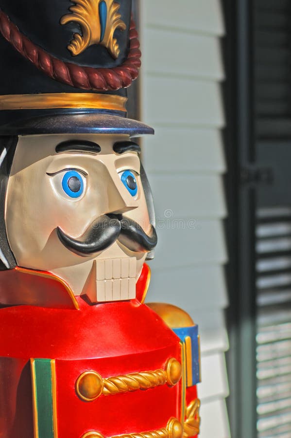 Closeup of vintage (Victorian) wooden toy soldier (5 feet tall) Christmas porch decoration. Closeup of vintage (Victorian) wooden toy soldier (5 feet tall) Christmas porch decoration