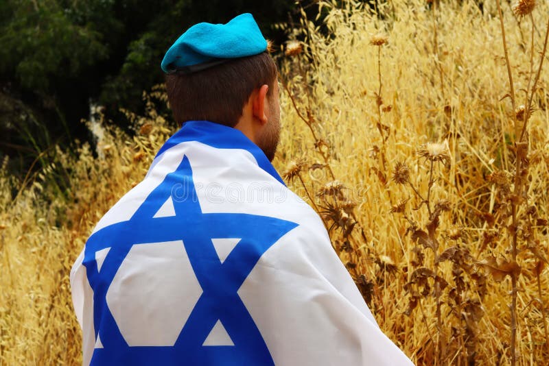 Soldier Israel , Patriot of the Jewish State, with a large Flag of Israel. Image for Israel Independence Day, Memorial Day, Holocaust Remembrance Day. Israeli Soldier, IDF. Soldier Israel , Patriot of the Jewish State, with a large Flag of Israel. Image for Israel Independence Day, Memorial Day, Holocaust Remembrance Day. Israeli Soldier, IDF