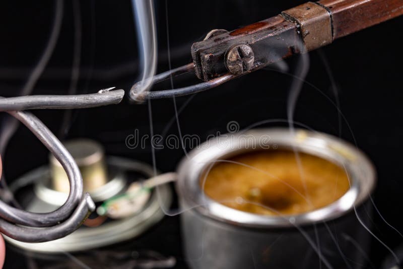 Soldering of an integrated circuit in an electronics workshop. Small electronic works royalty free stock photo Soldering of an integrated circuit in an electronics workshop. Small electronic works royalty free stock photo