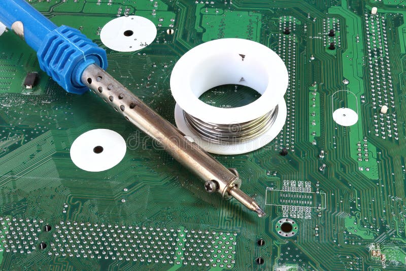 Soldering Iron on Green Mainboard for Repairing Electronic of the
