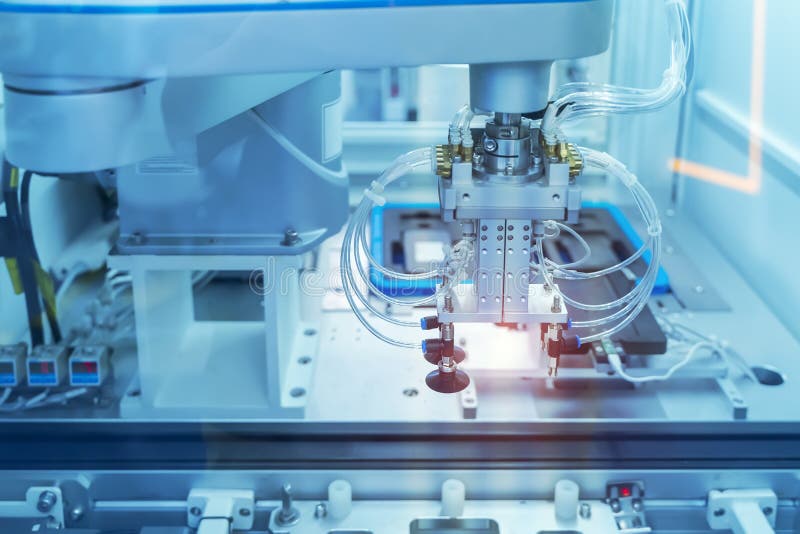 Soldering iron tips of robotic system for automatic point soldering for printed and assembly electric circuit board PCB royalty free stock photo