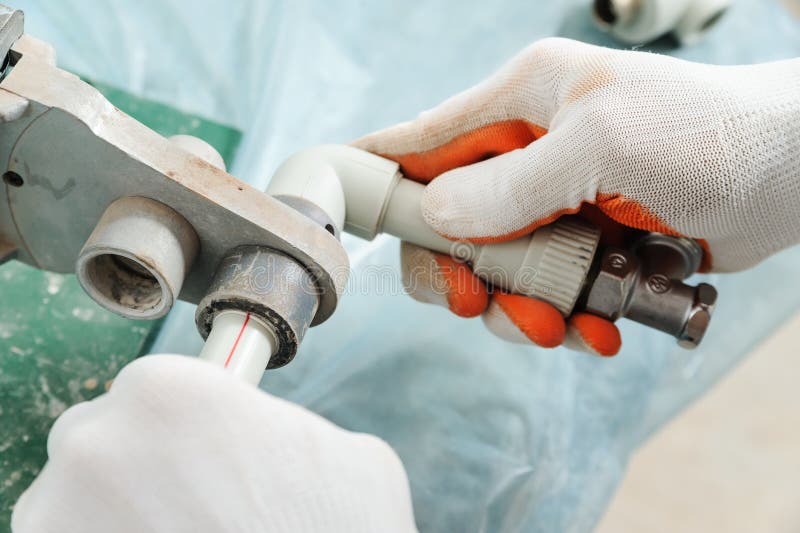 Soldering plastic pipe. stock photo. Image of heat, installation 78887634