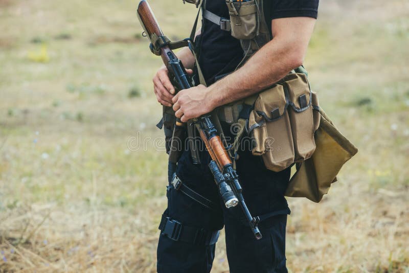 Soldier with a gun in the hands of the patrol area.