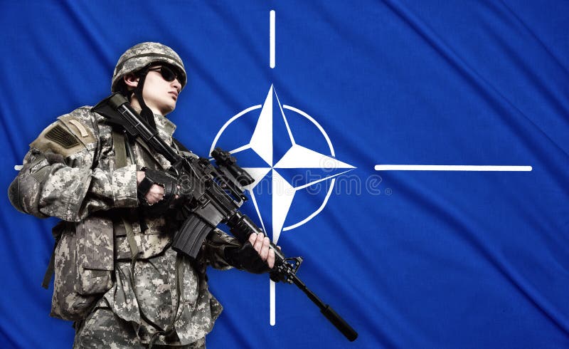 Soldier on NATO flag background stock photography Soldier on NATO flag background stock photography