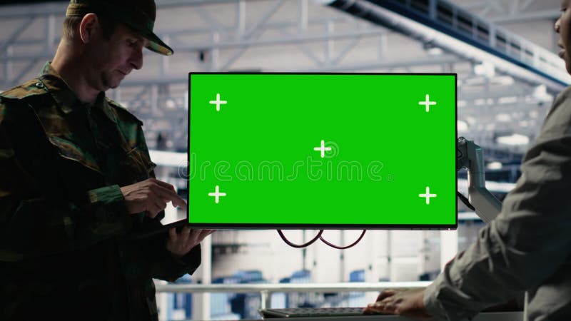 Soldier and technician in server hub use green screen computer to manage systems stock video footage
