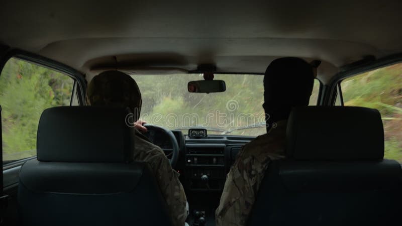 Soldiers Getting Inside A Car Trying To Run From The Enemies stock video footage