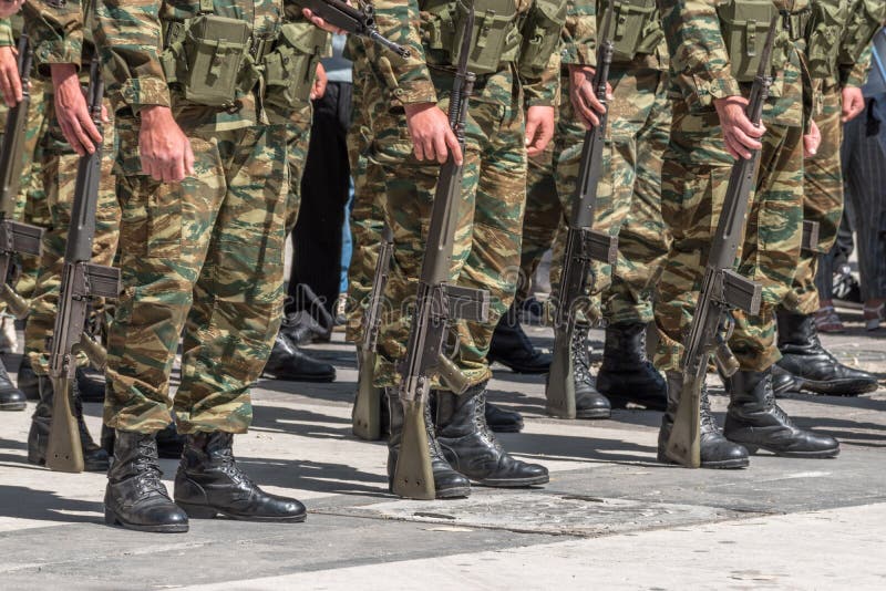 Soldiers Stand in Row with a Guns in Hand in Camouflage Uniforms Stock ...