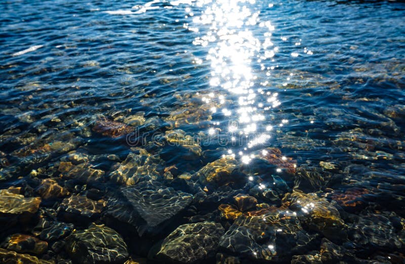 Bright shine and glare of the sun on transparent sea water. Bright shine and glare of the sun on transparent sea water