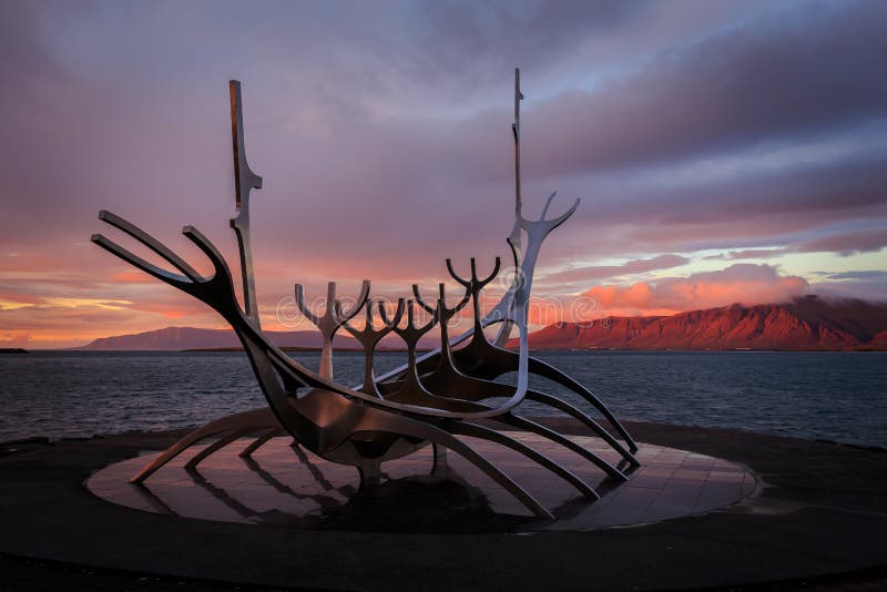 View of Solfar the Sun Voyager at sunset in Reykjavik, Iceland. A metal peace of art representing a Viking ship. View of Solfar the Sun Voyager at sunset in Reykjavik, Iceland. A metal peace of art representing a Viking ship.