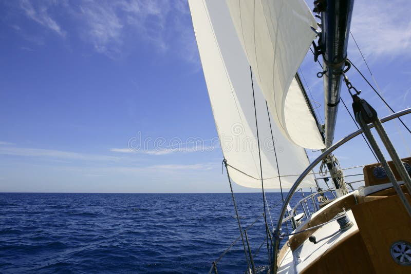 Sailboat sailing blue sea on sunny summer day in Mediterranean. Sailboat sailing blue sea on sunny summer day in Mediterranean