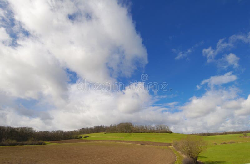 Beautiful cloudscape above the ground on a sunny day. Beautiful cloudscape above the ground on a sunny day.