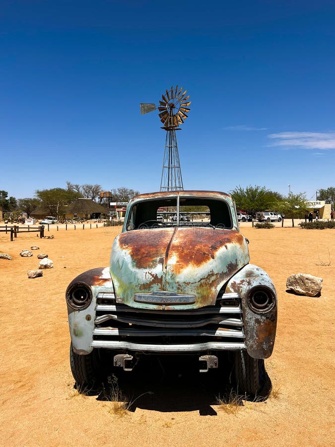 SOLITAIRE, NAMIBIA - NOVEMBER, 10, 2021: Abandoned old rusty car. Body of a retro car in the sands. Desert in Namibia, Africa. Solitaire city. SOLITAIRE, NAMIBIA - NOVEMBER, 10, 2021: Abandoned old rusty car. Body of a retro car in the sands. Desert in Namibia, Africa. Solitaire city.