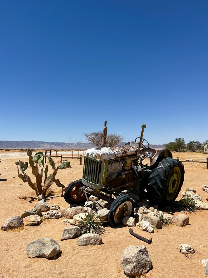 SOLITAIRE, NAMIBIA - NOVEMBER, 10, 2021: Abandoned old rusty tractor. Body of a retro car in the sands. Desert in Namibia, Africa. Solitaire city.