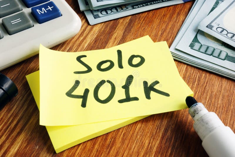 Solo 401k concept. Piece of paper, money and calculator. Solo 401k concept. Piece of paper, money and calculator