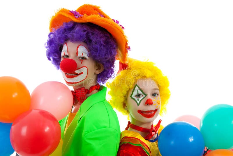som barn klädde clowner stående två arkivbild som barn klädde clowner stående två arkivbild