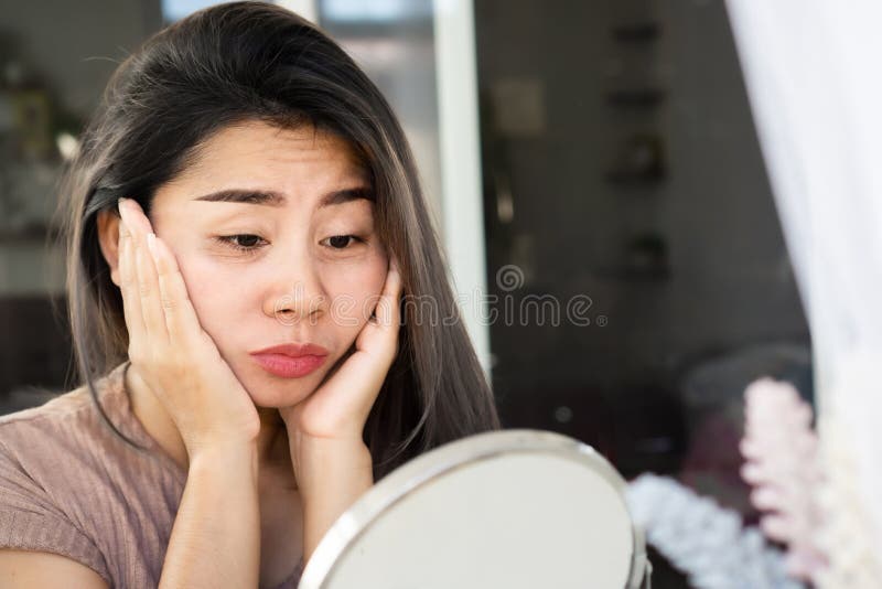 Asian woman having eyes bags , dark circles, wrinkle and crow`s feet on her face skin. Asian woman having eyes bags , dark circles, wrinkle and crow`s feet on her face skin