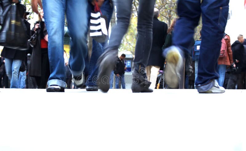 Teenager equipped as a Jean walks on the street in motion blur. Teenager equipped as a Jean walks on the street in motion blur