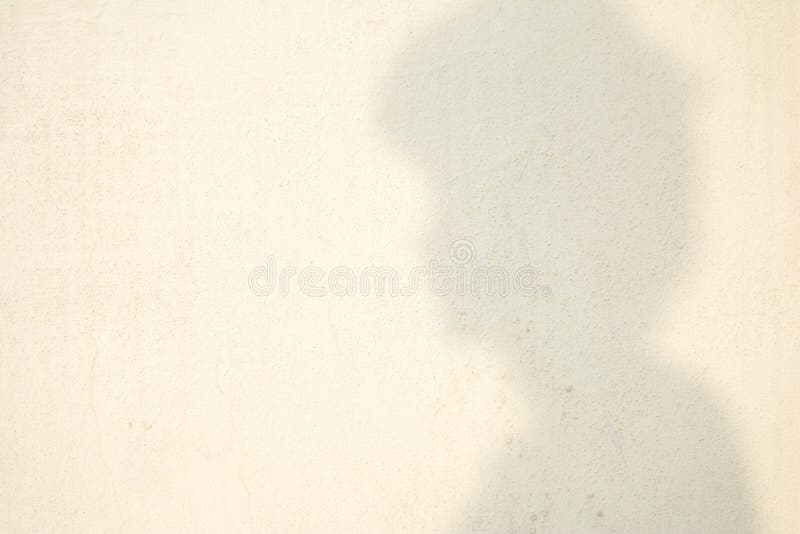 Sombra da cabeça humana na parede abstrata fotografia de stock royalty free Sombra da cabeça humana na parede abstrata fotografia de stock royalty free