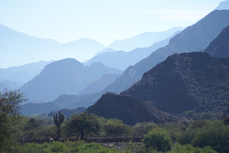 Many mountain shadows in a clear day. Many mountain shadows in a clear day