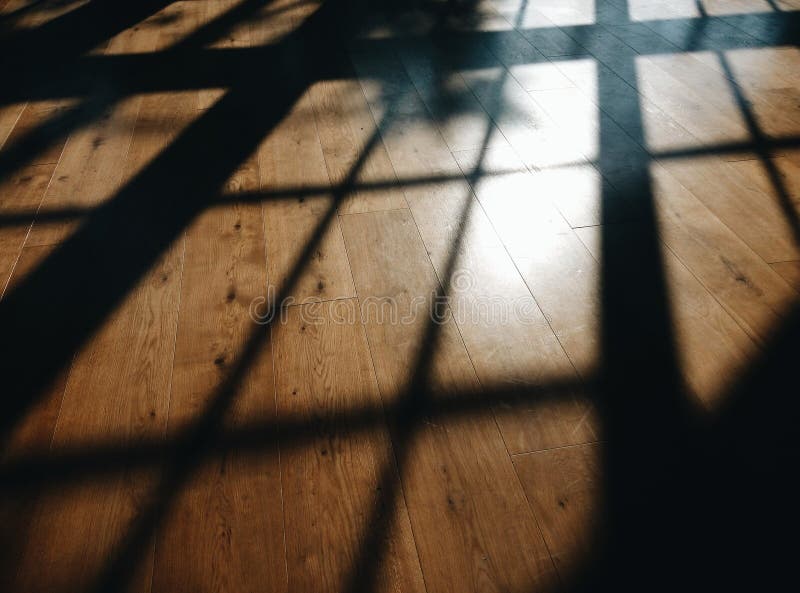 Sun shadows on the brown floor. Sun shadows on the brown floor