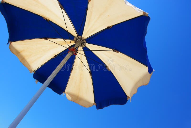 Sunshade at the beach on a very sunny day. Sunshade at the beach on a very sunny day