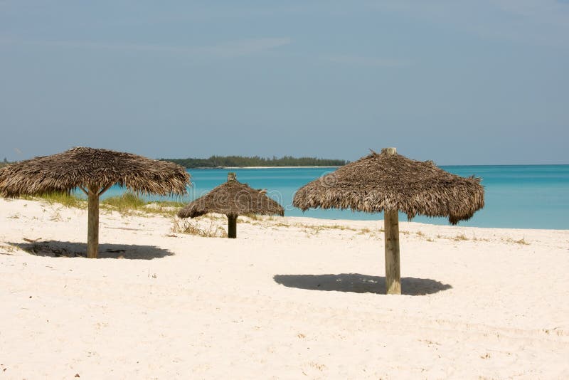 Thatched sunshade on a tropical beach in the Bahamas. Thatched sunshade on a tropical beach in the Bahamas