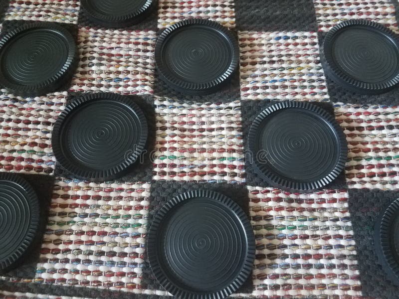 Black Plastic Checkers on Fabric Board Stock Image Image of