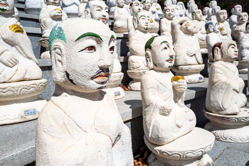 Some of the 500 Buddha’s Disciples statues in Bomunsa Temple on the island of Seongmodo, Ganghwa, Incheon, South Korea royalty free stock image Some of the 500 Buddha’s Disciples statues in Bomunsa Temple on the island of Seongmodo, Ganghwa, Incheon, South Korea royalty free stock image