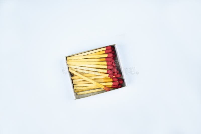 Some Flammable Red Fire Matches Gathered In A Small Match Box Before A White Background Stock