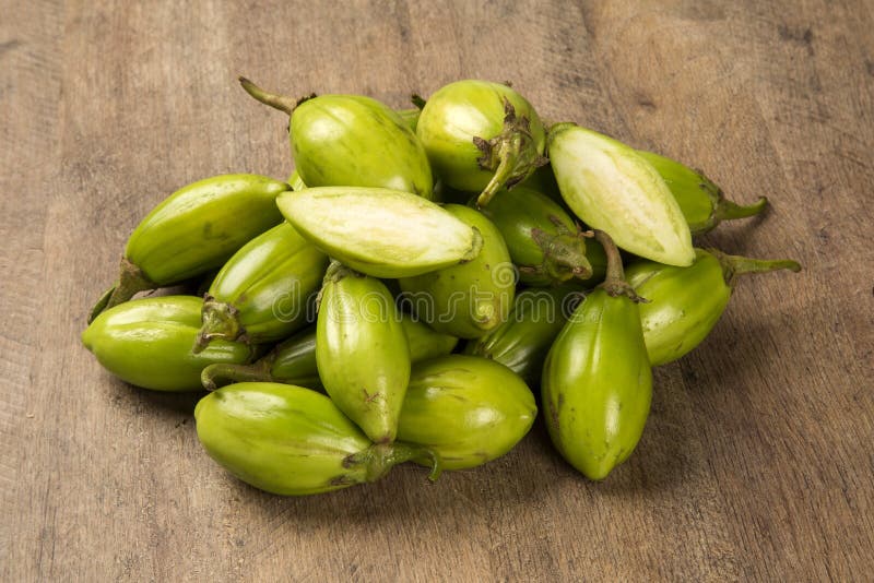 Some Green African Eggplants Over a Wooden Surface Stock Image Image