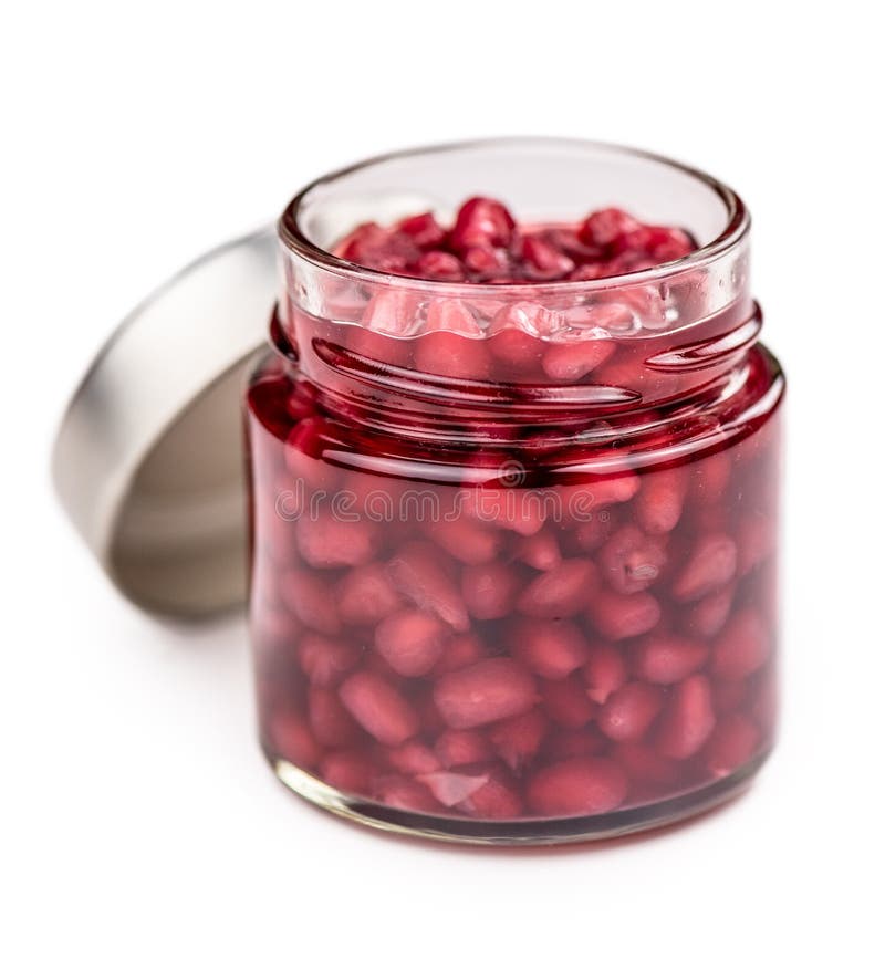 Some preserved Pomegranate seeds isolated on white selective focus. Some preserved Pomegranate seeds isolated on white selective focus