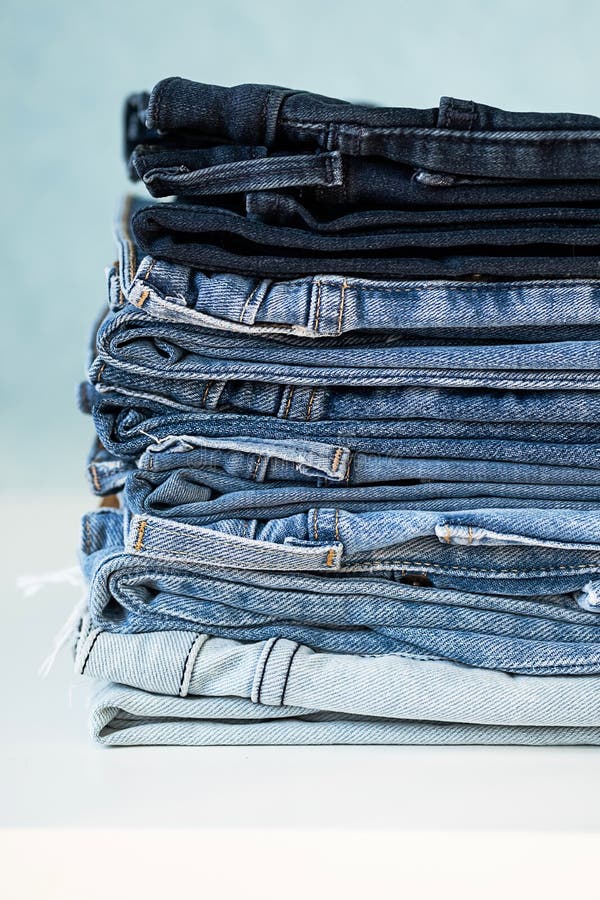 Some Stacked Blue Jeans, Close Up. Denim Collection Stock Photo - Image ...