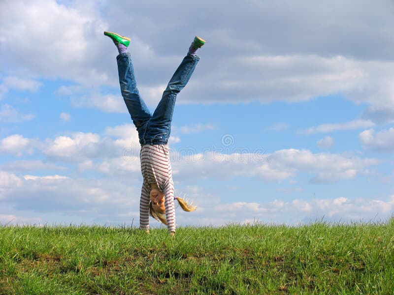 Download Somersault fotografia stock. Immagine di prato, armi, femmina - 205306