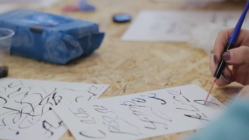 Something for lettering. woman paints, creating a