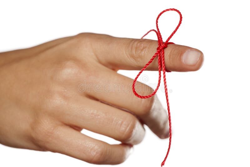 Index finger tied with a red thread. Index finger tied with a red thread