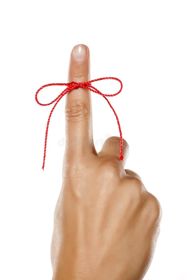 Index finger tied with a red thread. Index finger tied with a red thread