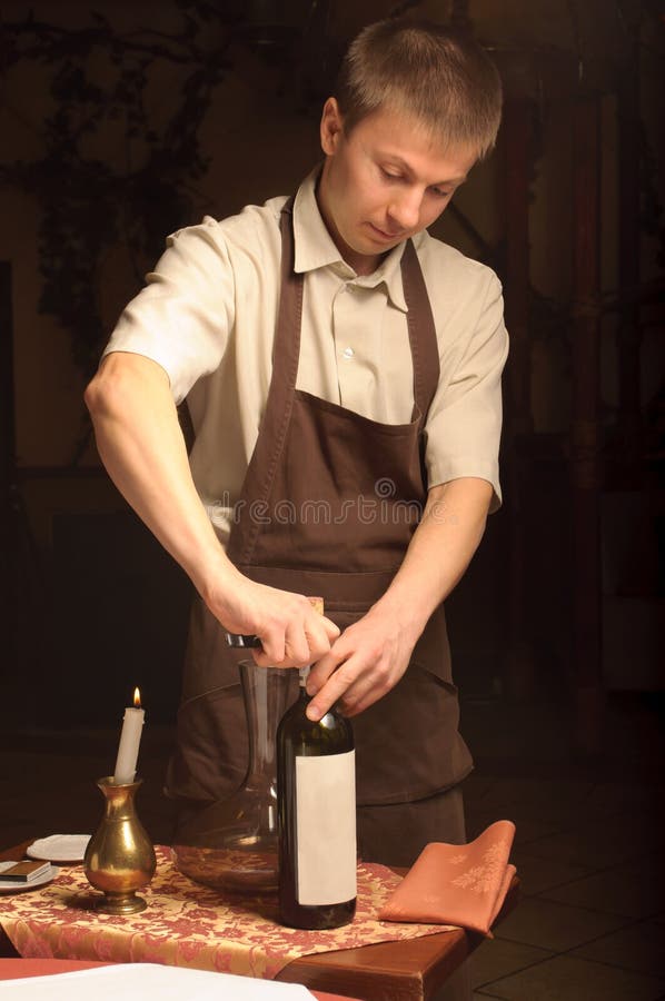 A sommelier opening wine bottle royalty free stock image A sommelier opening wine bottle royalty free stock image