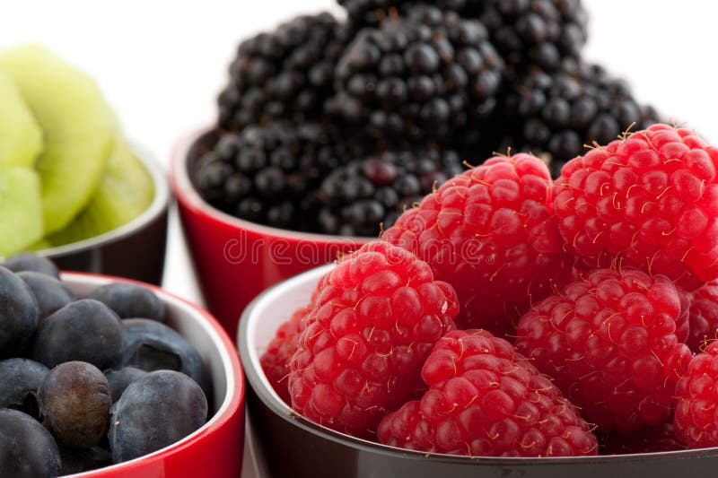 Mixture of summer fruit in black and red bowls. Mixture of summer fruit in black and red bowls