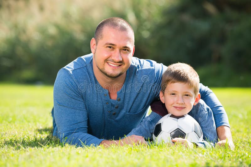 Son and Father with Football Ball Stock Photo - Image of active, father