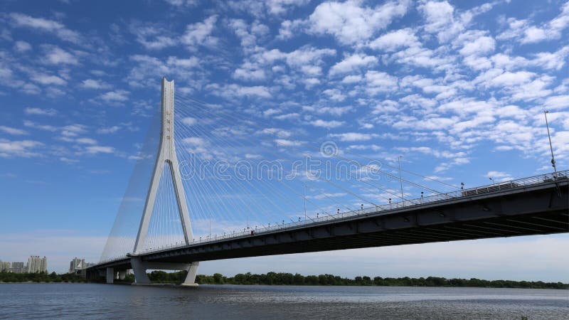 Songpu Bridge under blue sky, famous landmark of Harbin, China. Songpu Bridge