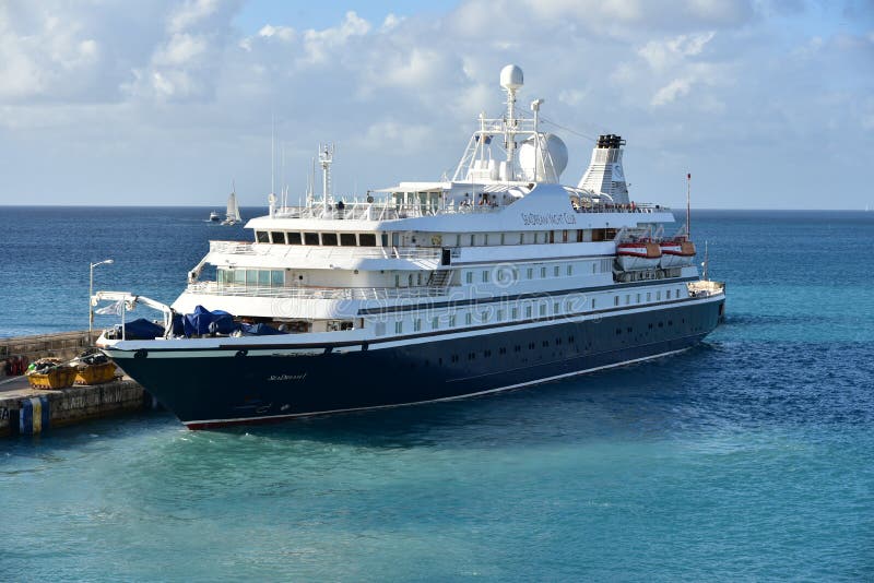 Sea Dream 1 is a small luxury cruising vessel owned by the Sea Dream Yacht Club. It is shown here docking in Barbados. Sea Dream 1 is a small luxury cruising vessel owned by the Sea Dream Yacht Club. It is shown here docking in Barbados