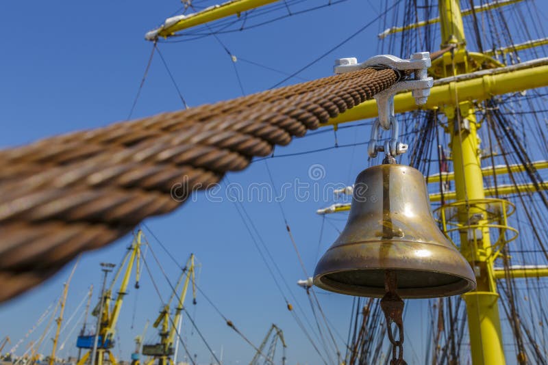 Old metal alarm bell of an moored tall ship. Old metal alarm bell of an moored tall ship.