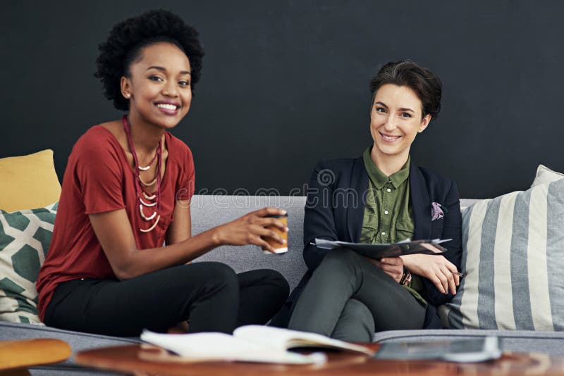 Woman, smile and teamwork in sofa with planning for meeting on brainstorming and collaboration for project. Graphic designer, discussion and portrait in startup company for report and feedback. Woman, smile and teamwork in sofa with planning for meeting on brainstorming and collaboration for project. Graphic designer, discussion and portrait in startup company for report and feedback.