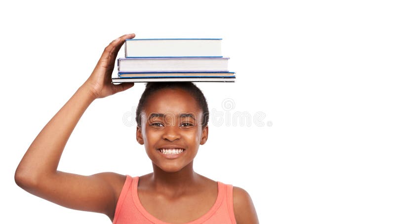 Portrait, smile and black girl with books on her head, education and balance isolated on a white studio background. Face, African person and model with mockup space and learning with knowledge. Portrait, smile and black girl with books on her head, education and balance isolated on a white studio background. Face, African person and model with mockup space and learning with knowledge.