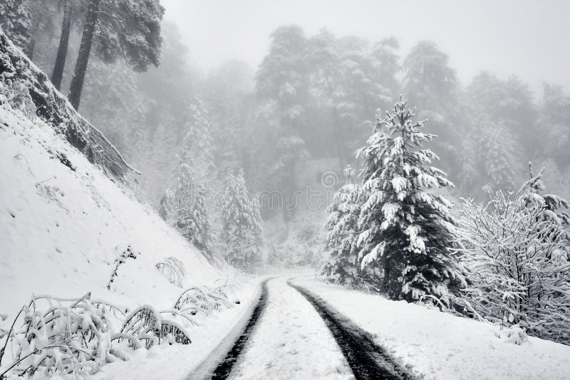 A sonwy and foggy mountain road royalty free stock images A sonwy and foggy mountain road royalty free stock images