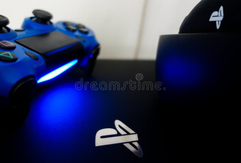 Sony Playstation Logo Illuminated on Blue Light from Game Controller